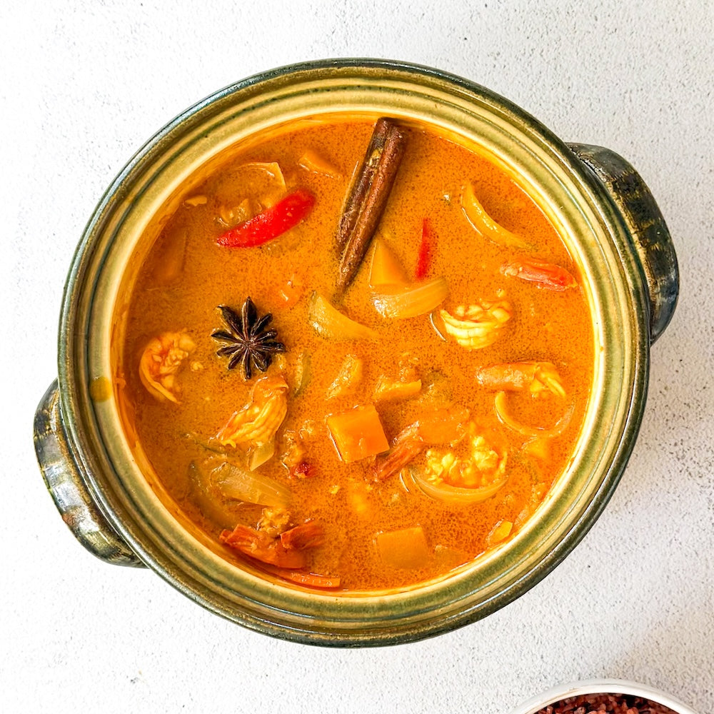 Thai coconut shrimp curry with butternut squash and bell pepper, flavored with cinnamon and star anise, made with Watcharee’s Thai Coconut Curry Sauce